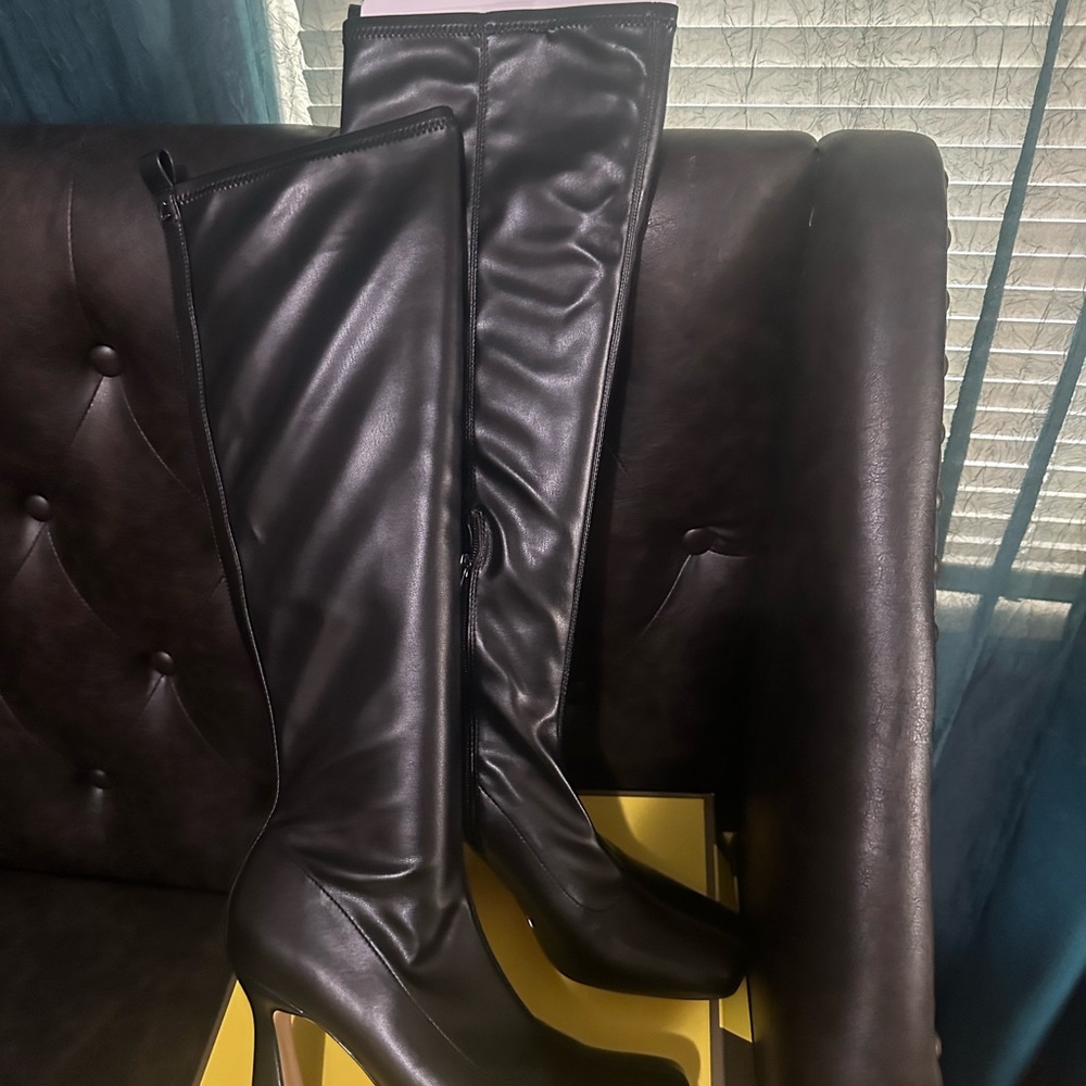 Sleek Black Leather Heeled Boots